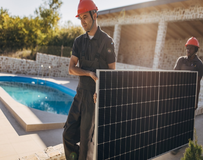 Technicians Installing Solar Pool Heaters in the Villages, FL
